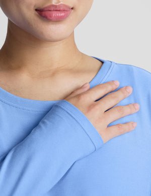 blue long sleeve maternity top with a crew neckline.