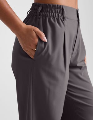 grey mid rise trousers with pockets.