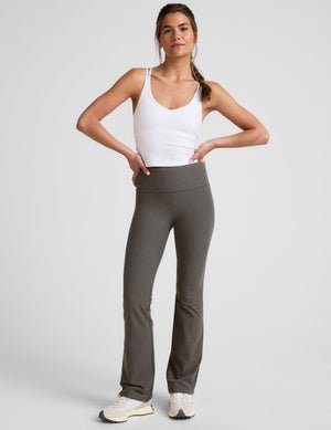 grey high-waisted bootcut pants.