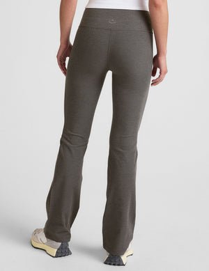 grey high-waisted bootcut pants.