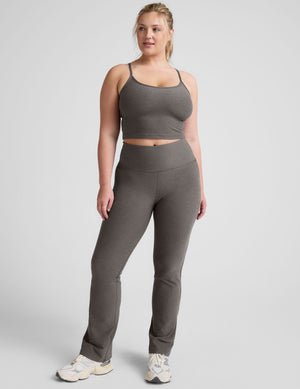 grey high-waisted bootcut pants.