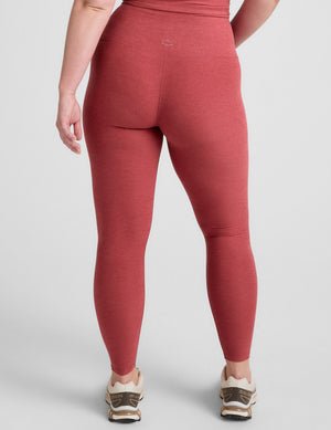 red high-waisted midi length leggings.