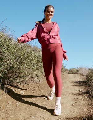 red high-waisted midi length leggings.