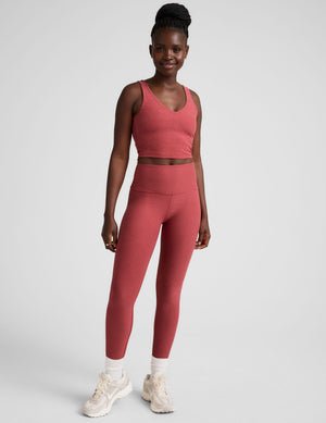 red high-waisted midi length leggings.