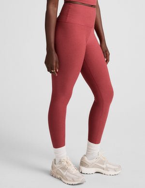 red high-waisted midi length leggings.